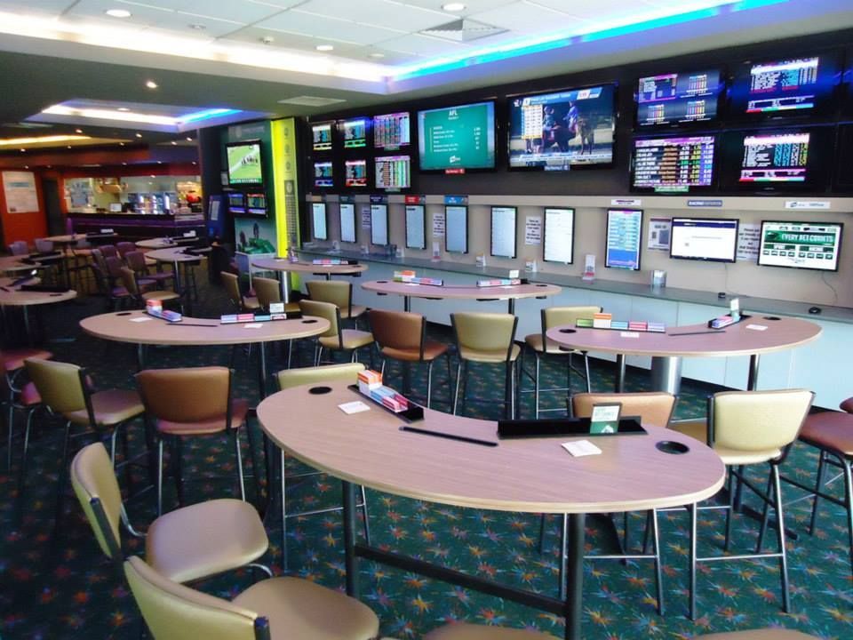 A Room With Tables And Chairs And A Wall Of Televisions — Logic Joinery In Fountaindale, NSW
