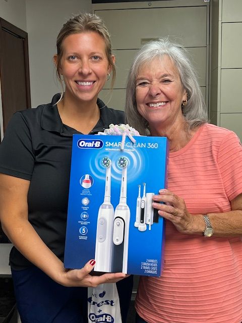Two Women With Oral-B SmartClean Toothbrush Box
