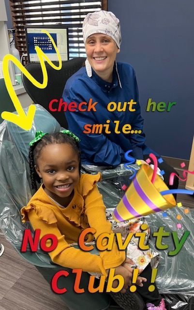Child & Dentist Celebrating Visit
