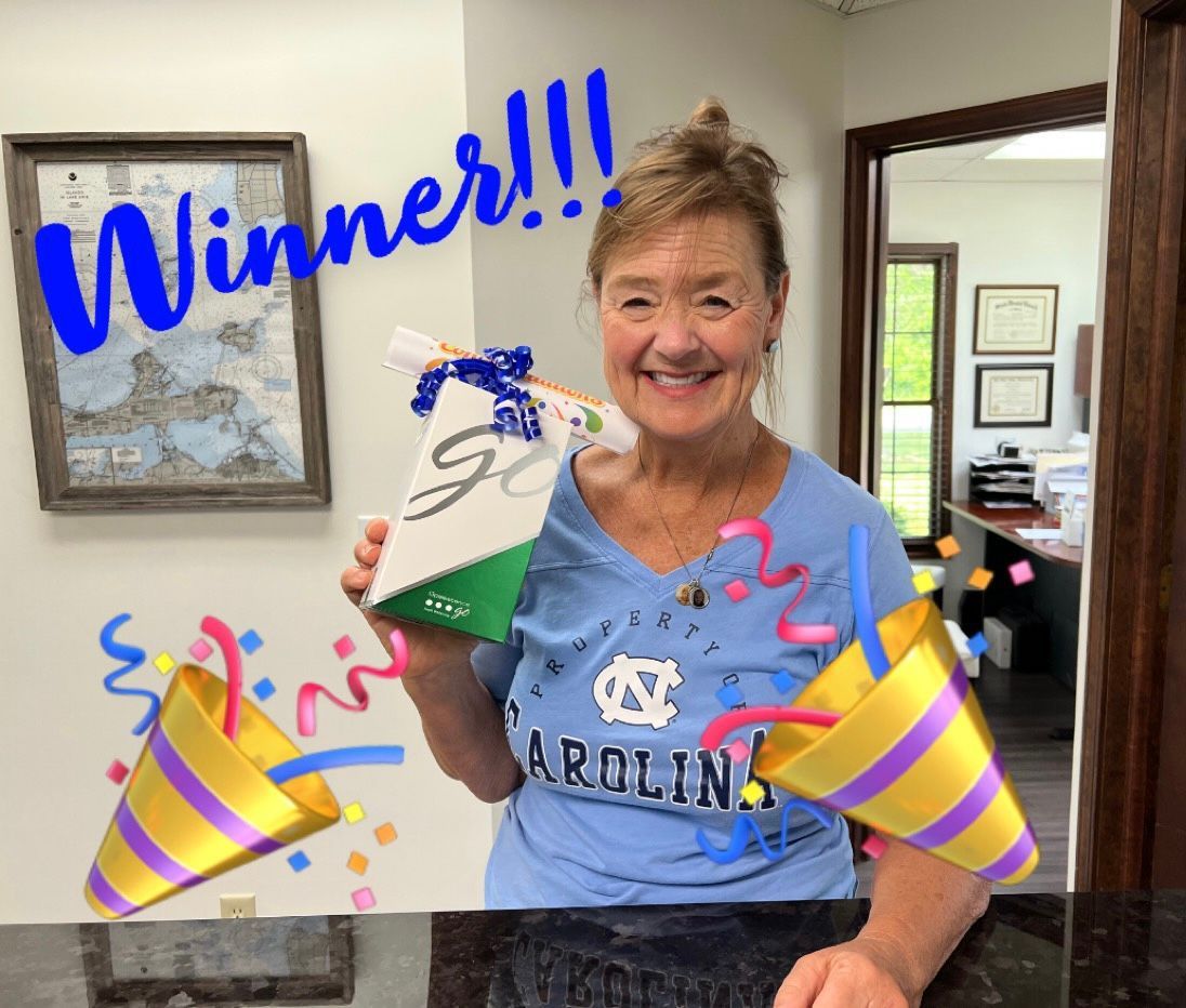 Smiling Person Holding a Gift
