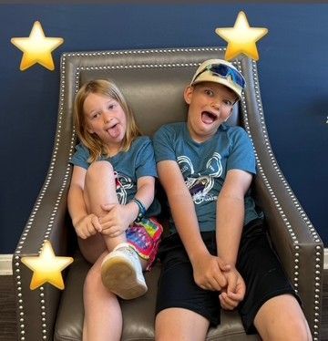 Two Children Make Funny Faces
