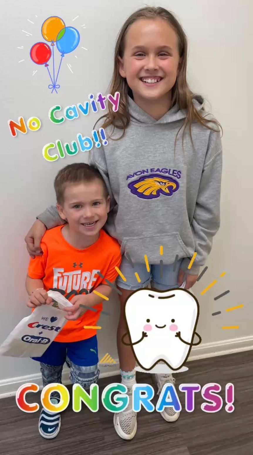 Two Smiling Children Pose
