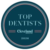 A purple and silver badge reading: Glenn J. Kuemerle, DDS, Selected topDENTISTS, 2025.