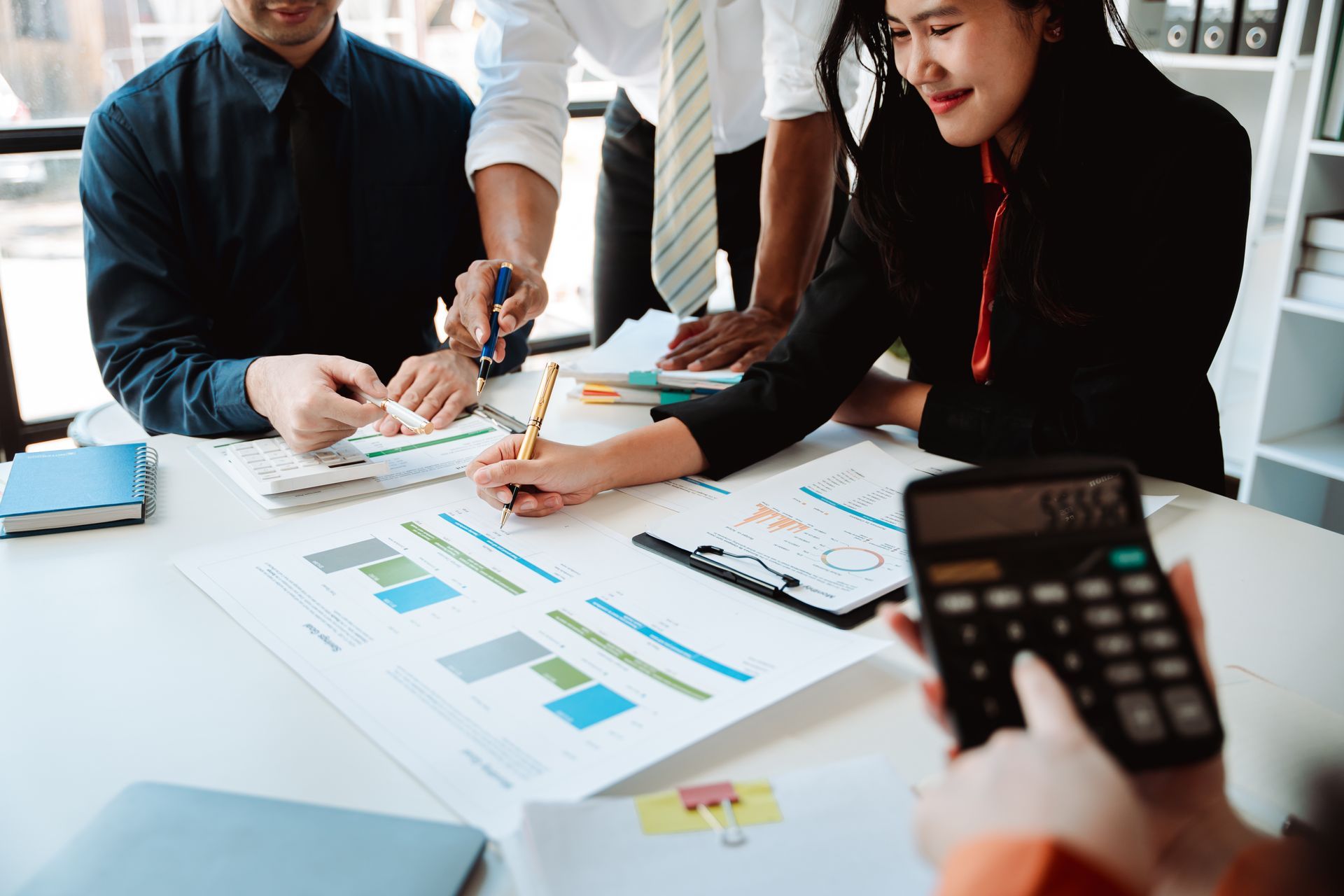 The financiers are calculating personal taxes for their customers. The financiers are calculating personal taxes for their customers.