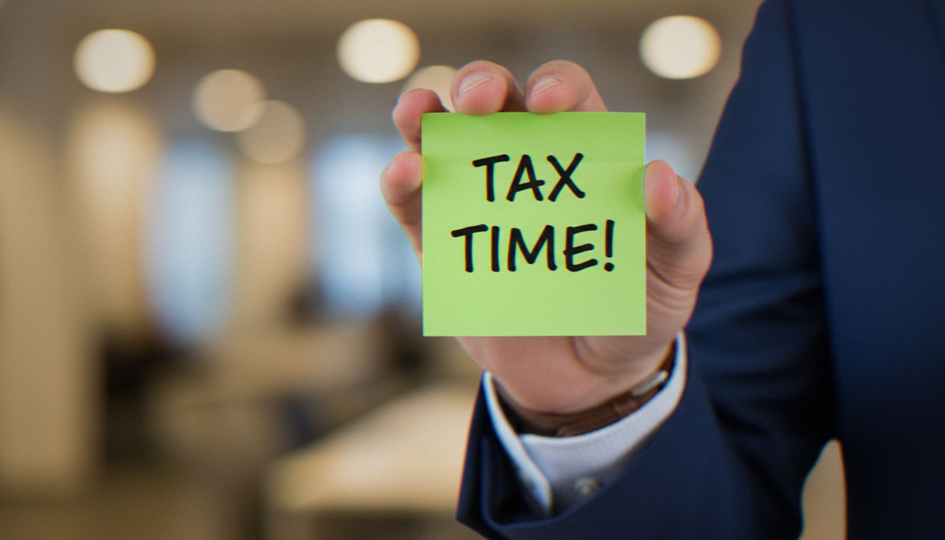 Business Tax Preparation specialist reviewing financial documents with a client.