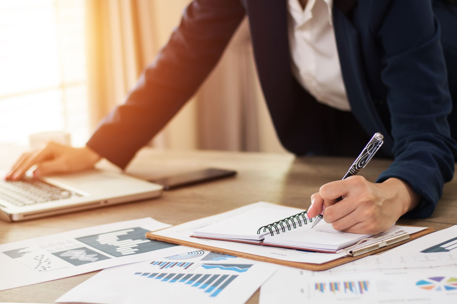 Financial manager writing, representing efficiency and certified public accountant services.