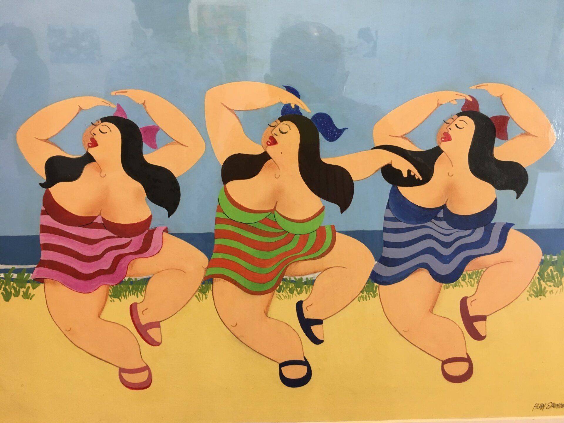 Three figures in striped dresses dance on a beach with arms raised, each wearing a bow in their hair.