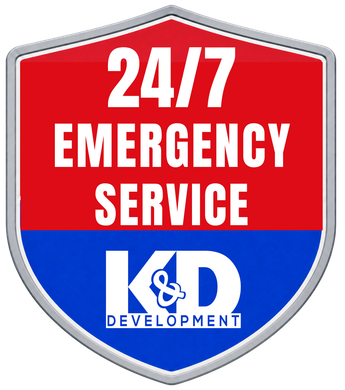 Red, white, and blue shield logo reading “24/7 Emergency Service” with K&D Development at the bottom