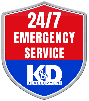 Red shield logo reading “24/7 Emergency Service” with K&D Development branding in blue and white