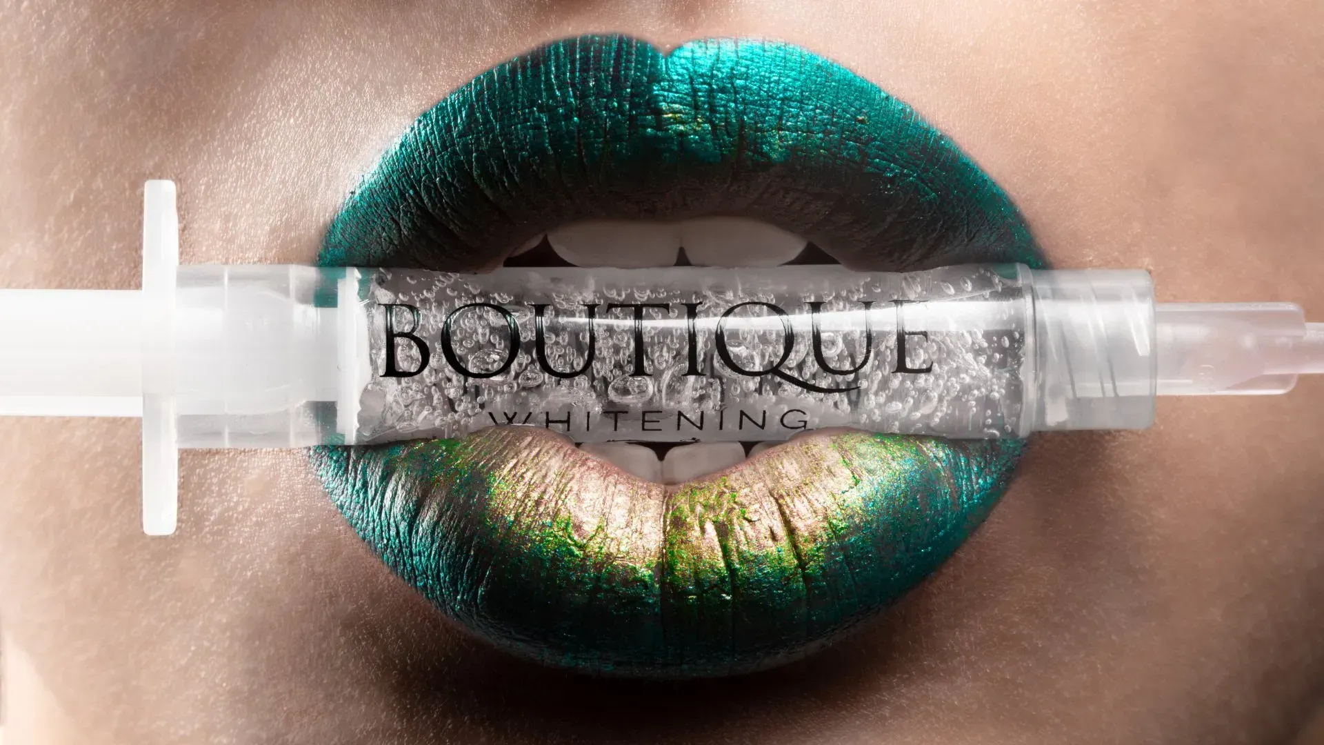 A Woman With Green Lipstick is Holding a Syringe in Her Mouth — Jaw Gear Dental Prosthetics in Bowral, NSW