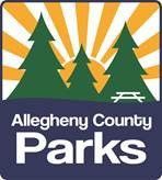 Allegheny County Parks logo with green trees, sun rays, and picnic table on blue background