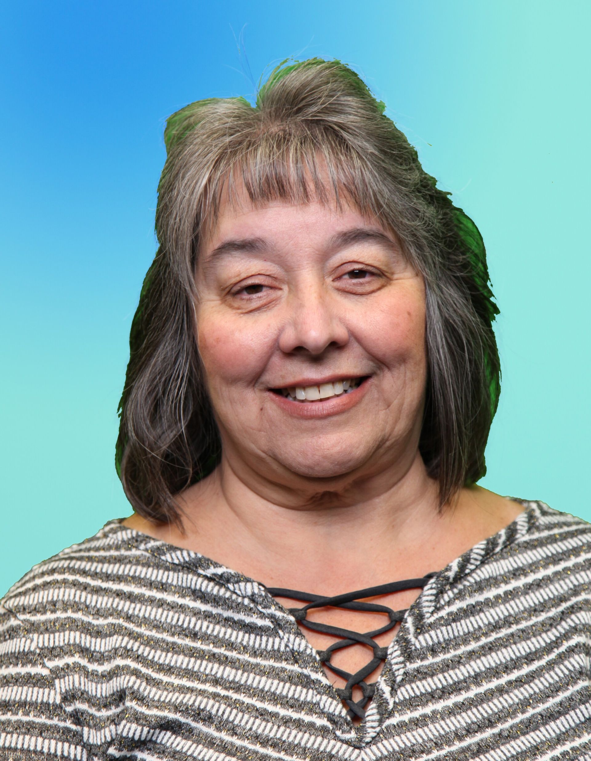 Portrait of a smiling woman in a striped top against a blue-green gradient background