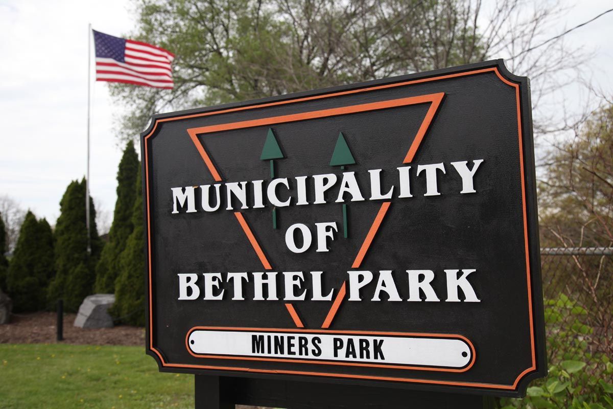 Bethlehem Park municipality sign with an American flag in the background