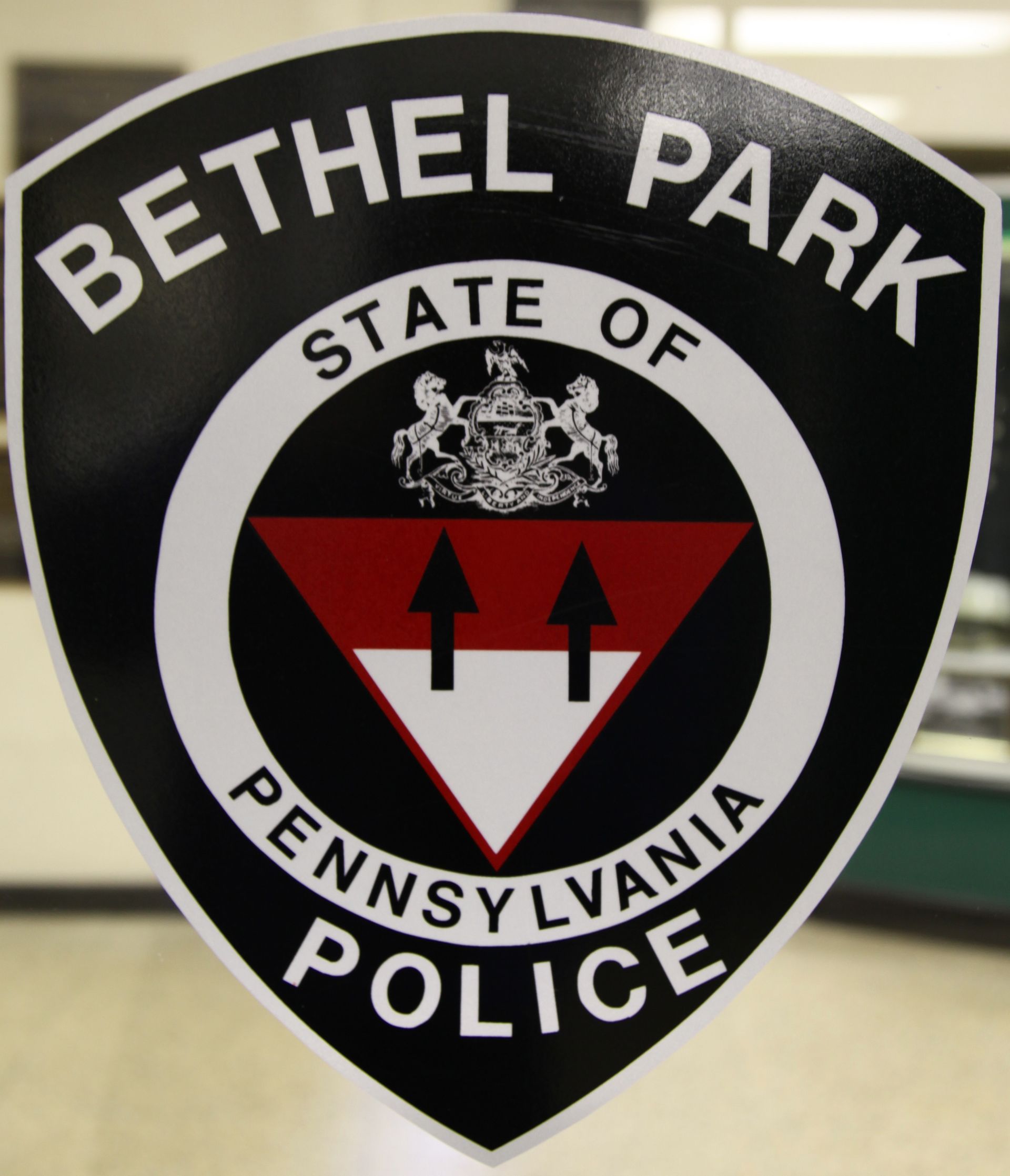 Bethel Park State Police badge with black, red, and white seal on a shield-shaped emblem