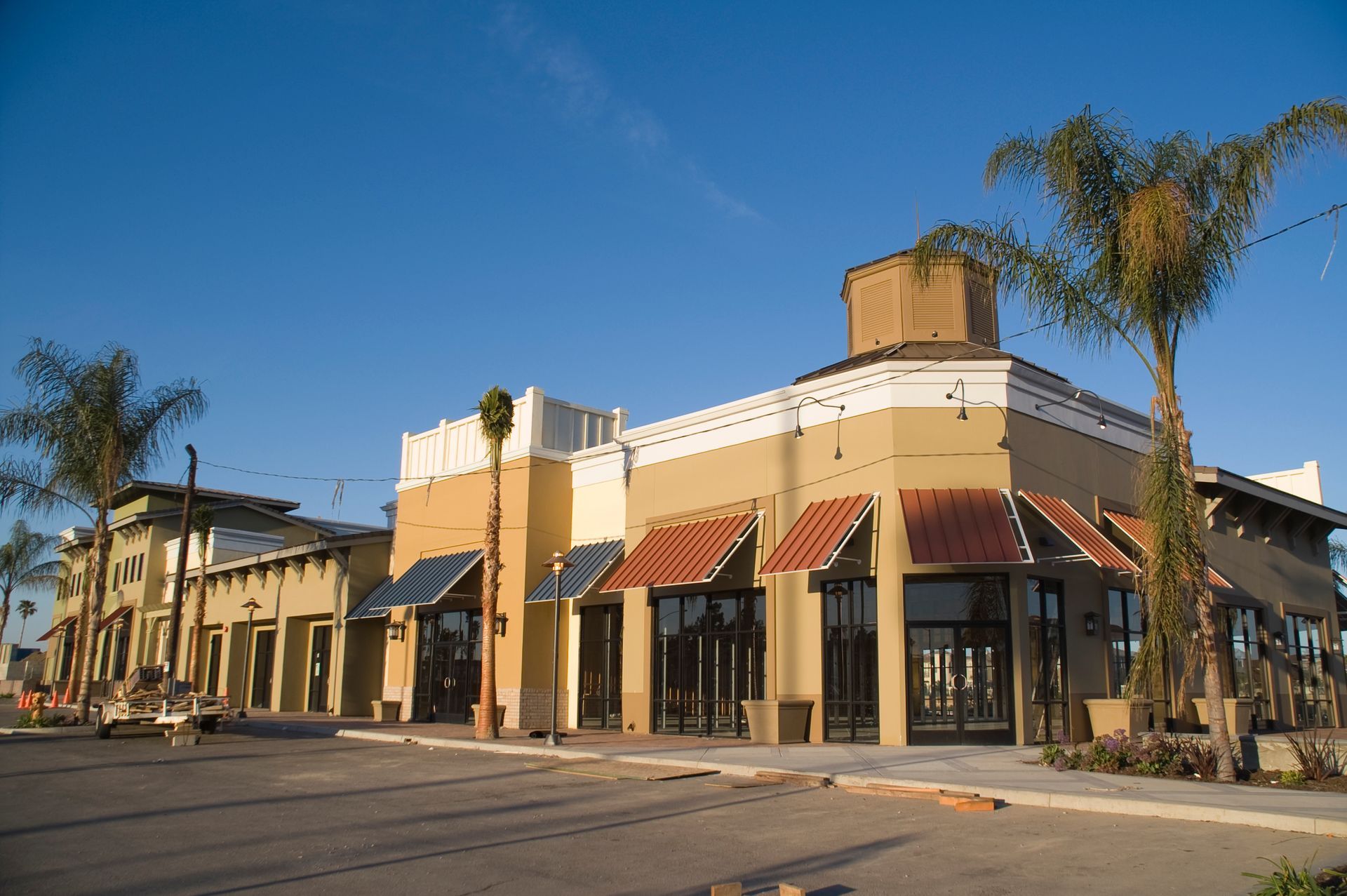 A Building with a Lot of Windows and a Palm Tree in Front of it — Valrico, FL — R Bennett A Building with a Lot of Windows and a Palm Tree in Front of it — Valrico, FL — R Bennett