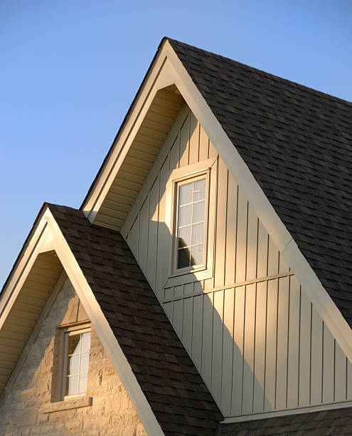 A House with a Roof that has a Window on it — Valrico, FL — R Bennett