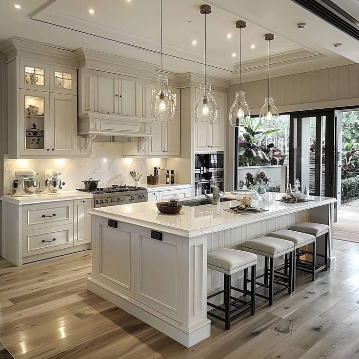 Elegant, bright kitchen with a marble island and matching cabinets.