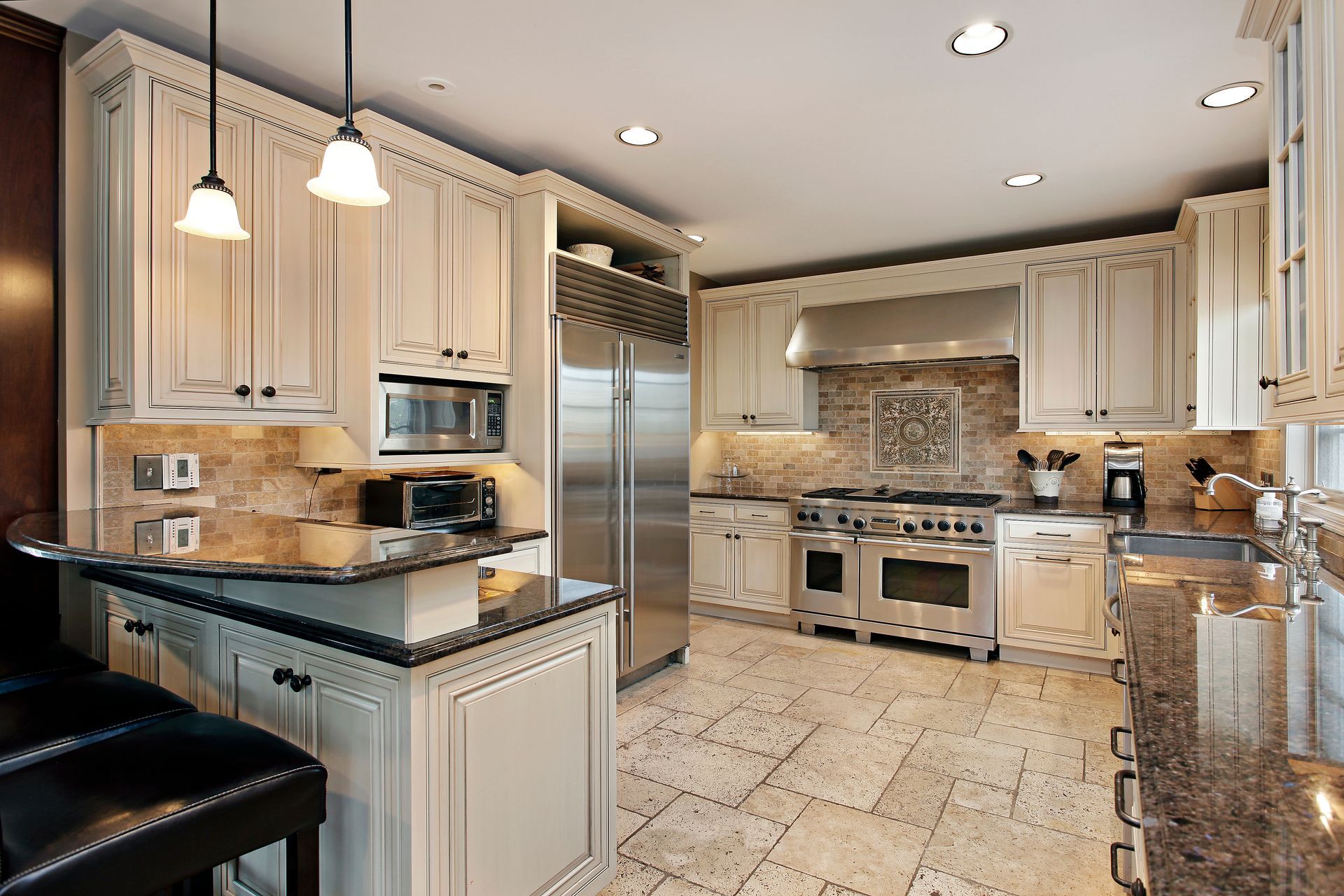 White kitchen counter with wooden utensils, cutting boards, and a small potted plant against white tile