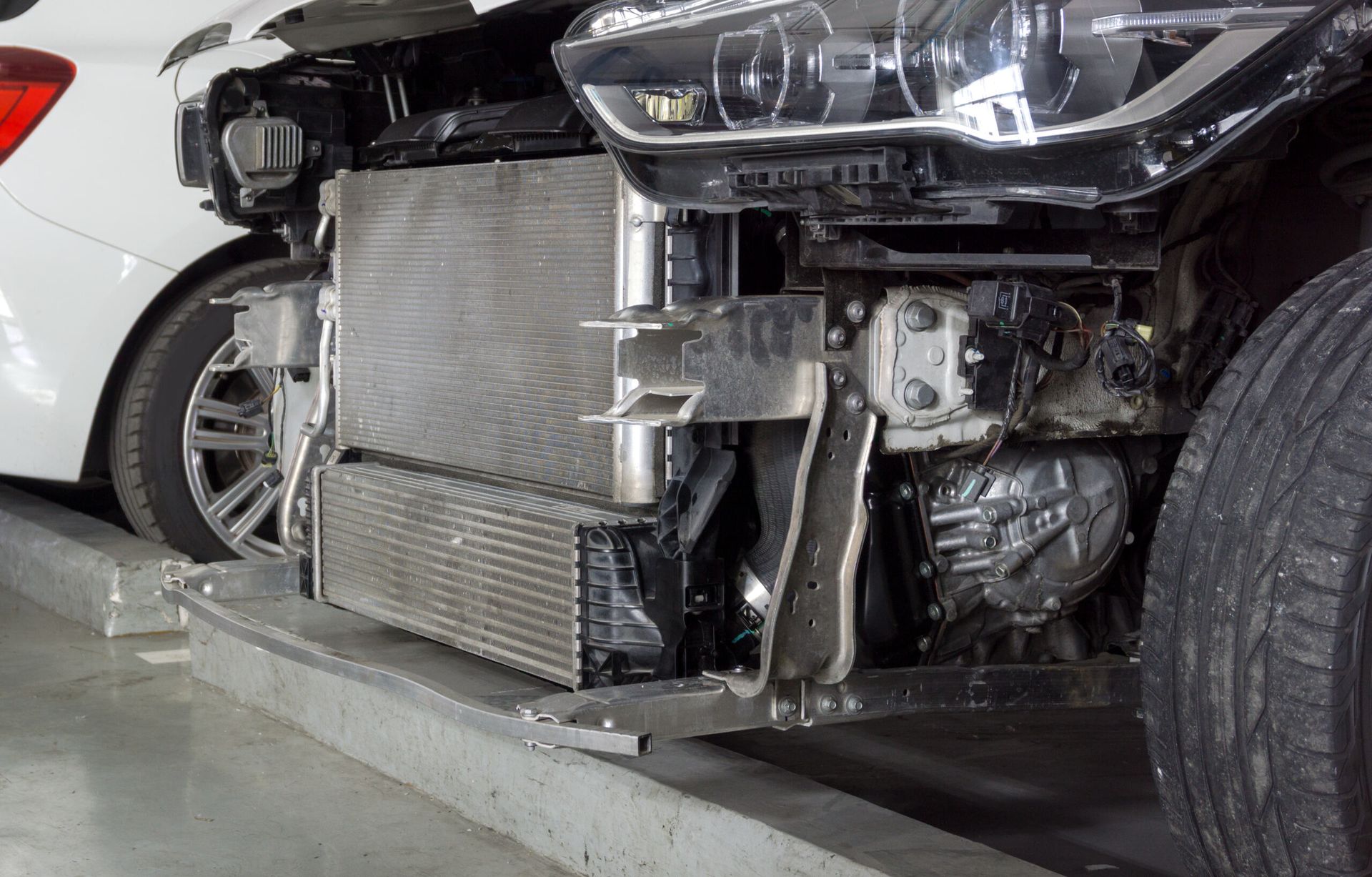 A Car With the Front End Removed is Parked in a Parking Garage — JJE Automotive In Yarrawonga, NT
