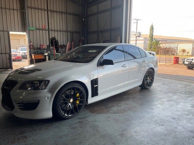 A White Sports Car in a Repair Shop — JJE Automotive In Yarrawonga, NT