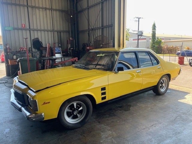 A Car on a Lift in a Garage — JJE Automotive In Yarrawonga, NT