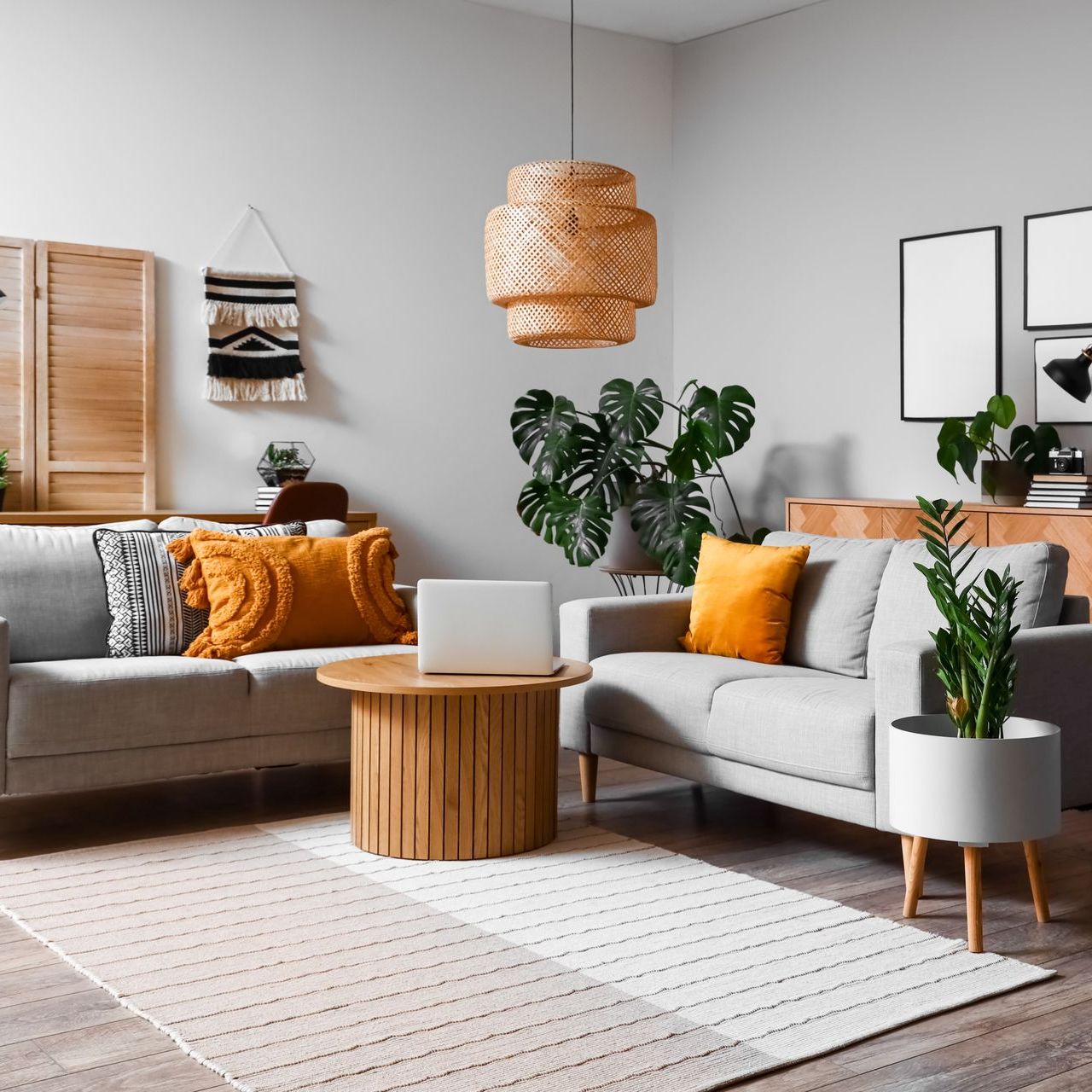 a living room with a couch and a table with a laptop on it