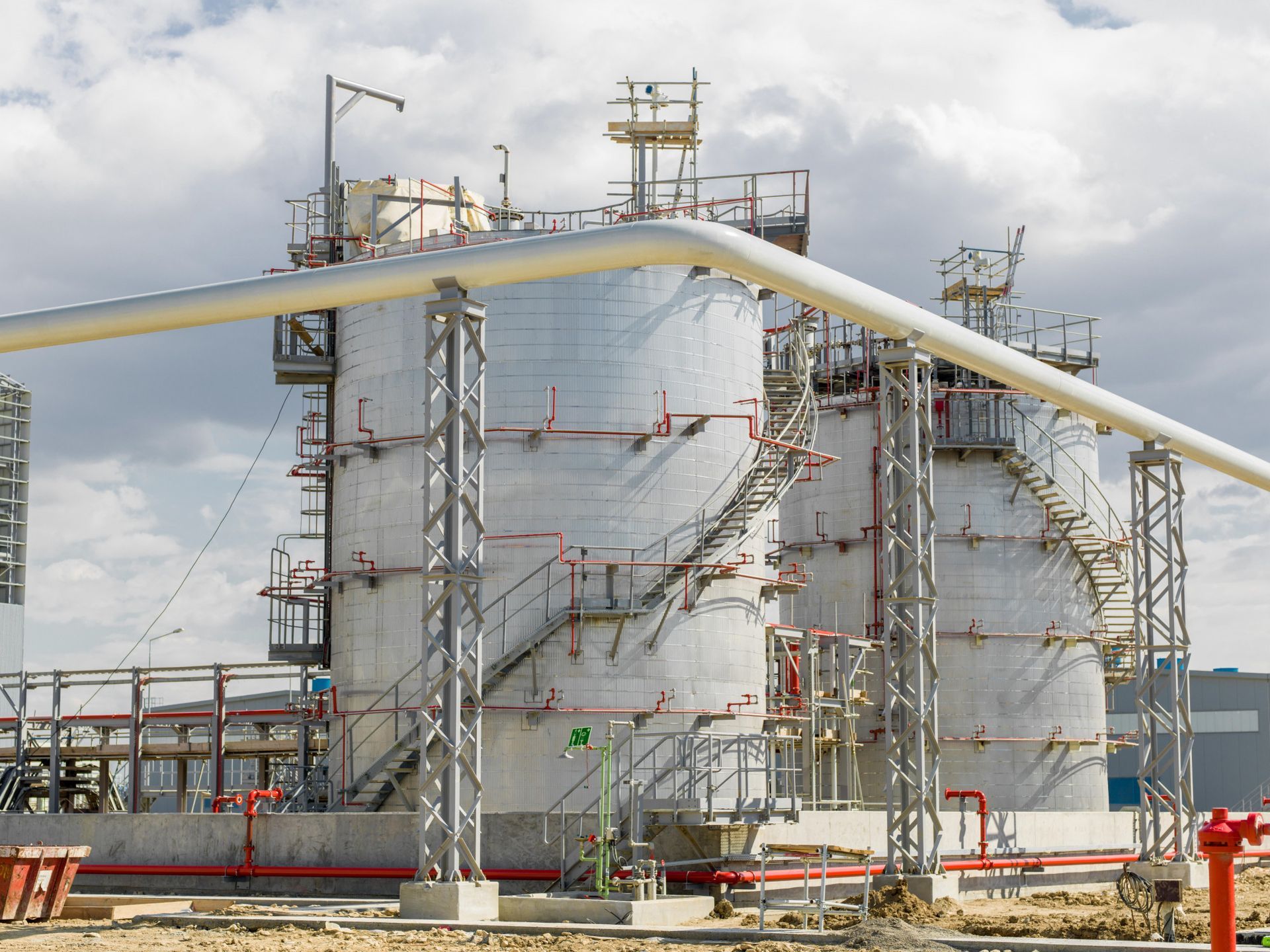 A factory with a lot of tanks and pipes.