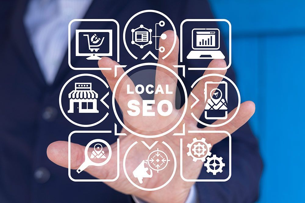 A man in a suit is holding a virtual screen with icons for local SEO.
