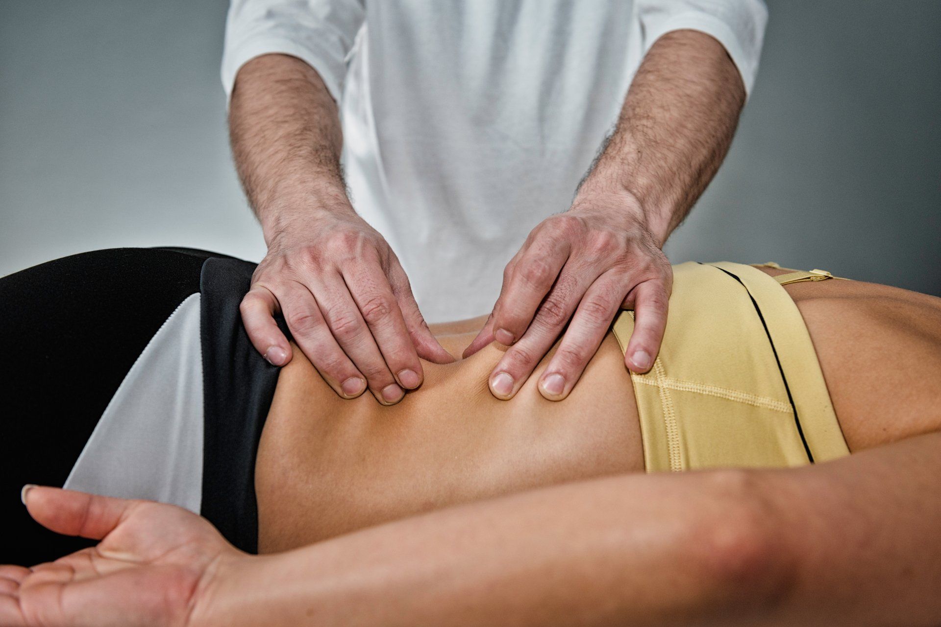 patient receiving myofascial release therapy on an injured low back
