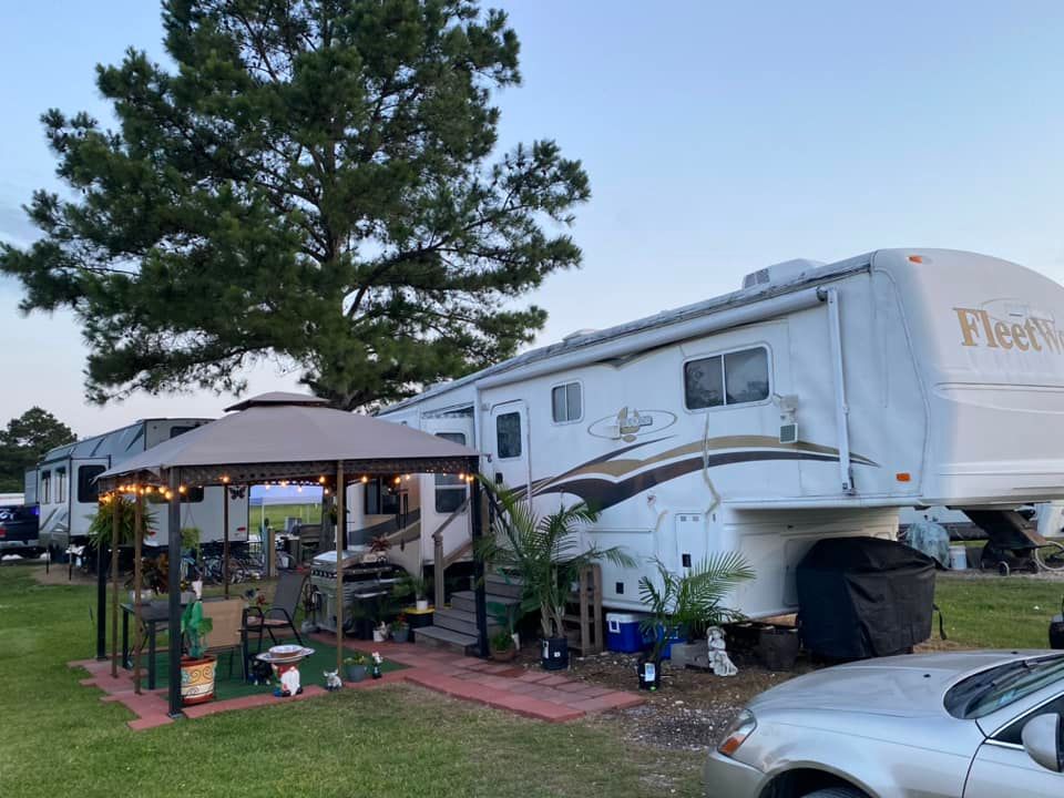 Well maintained RV park lane with organized long-term parking spaces