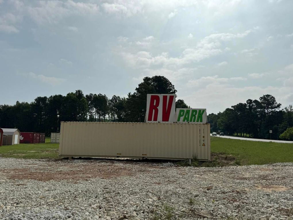 RV park management team helping customers with space planning