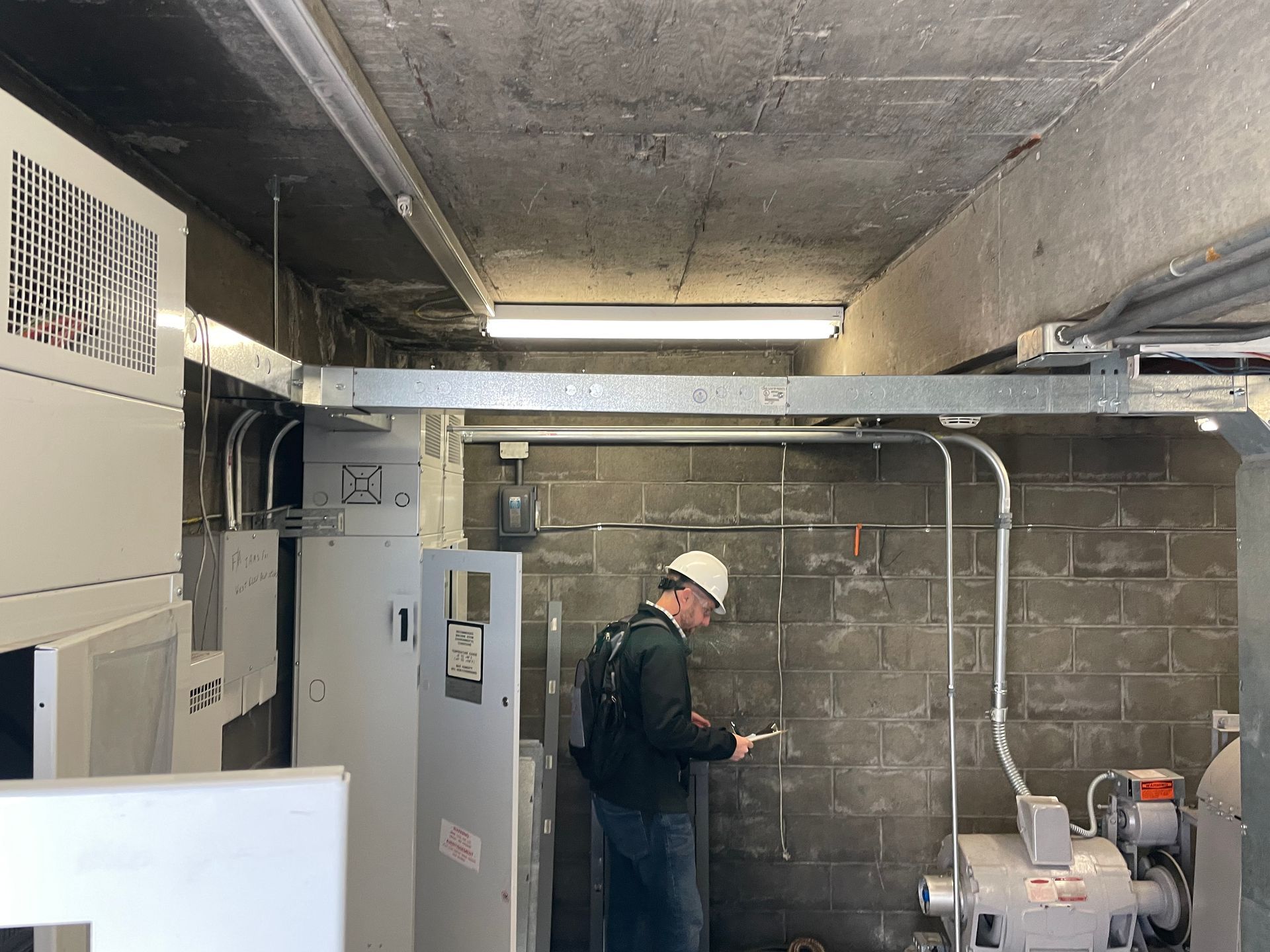 Elevator consultant inspecting an elevator machine
