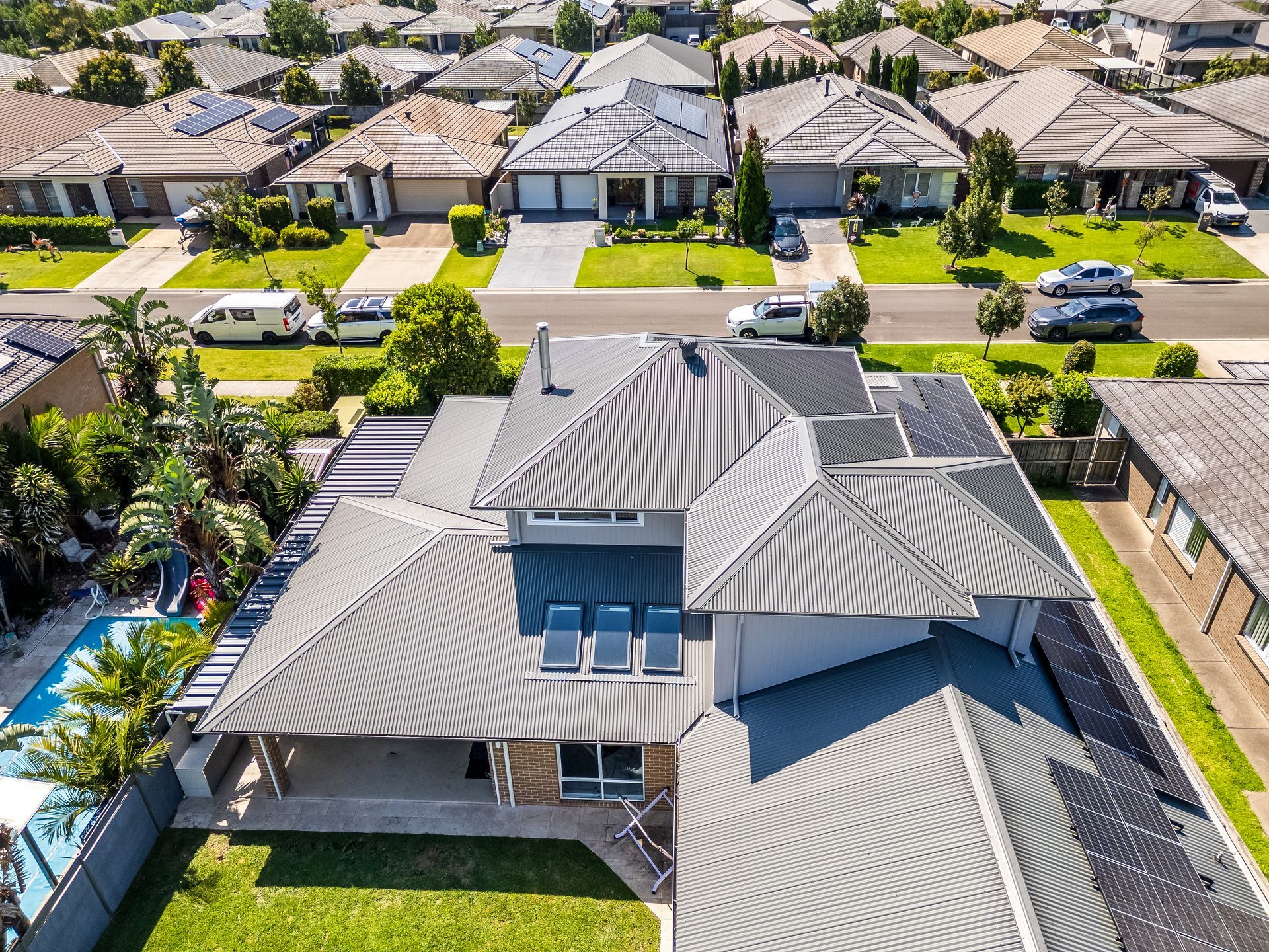 Aerial View of a Large Gray-roofed House in a Suburban Neighborhood — Matt Made Building in Camden, NSW