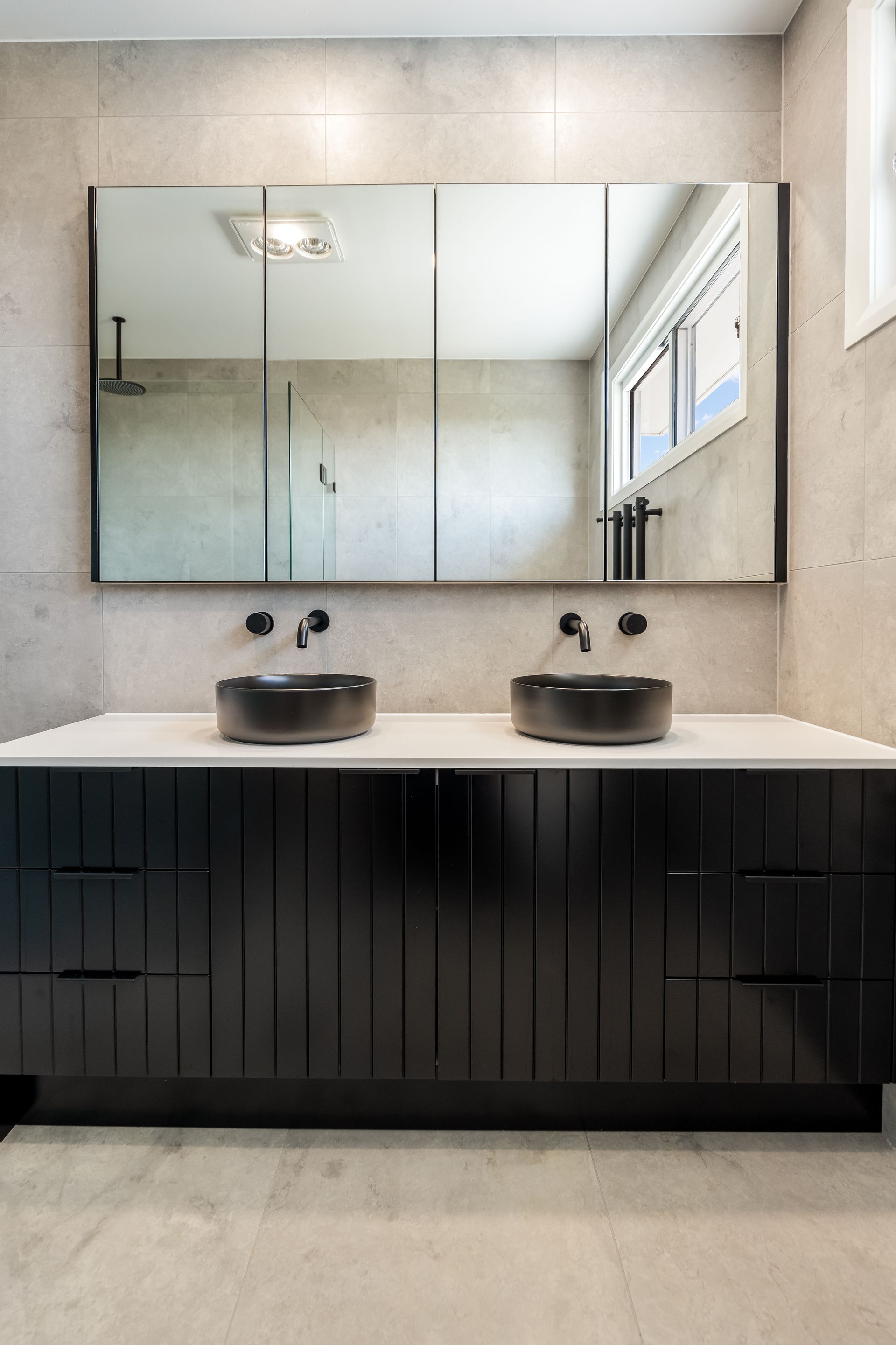 Modern Bathroom Vanity With Double Sinks and a Large Mirrored Medicine Cabinet — Matt Made Building in Camden, NSW
