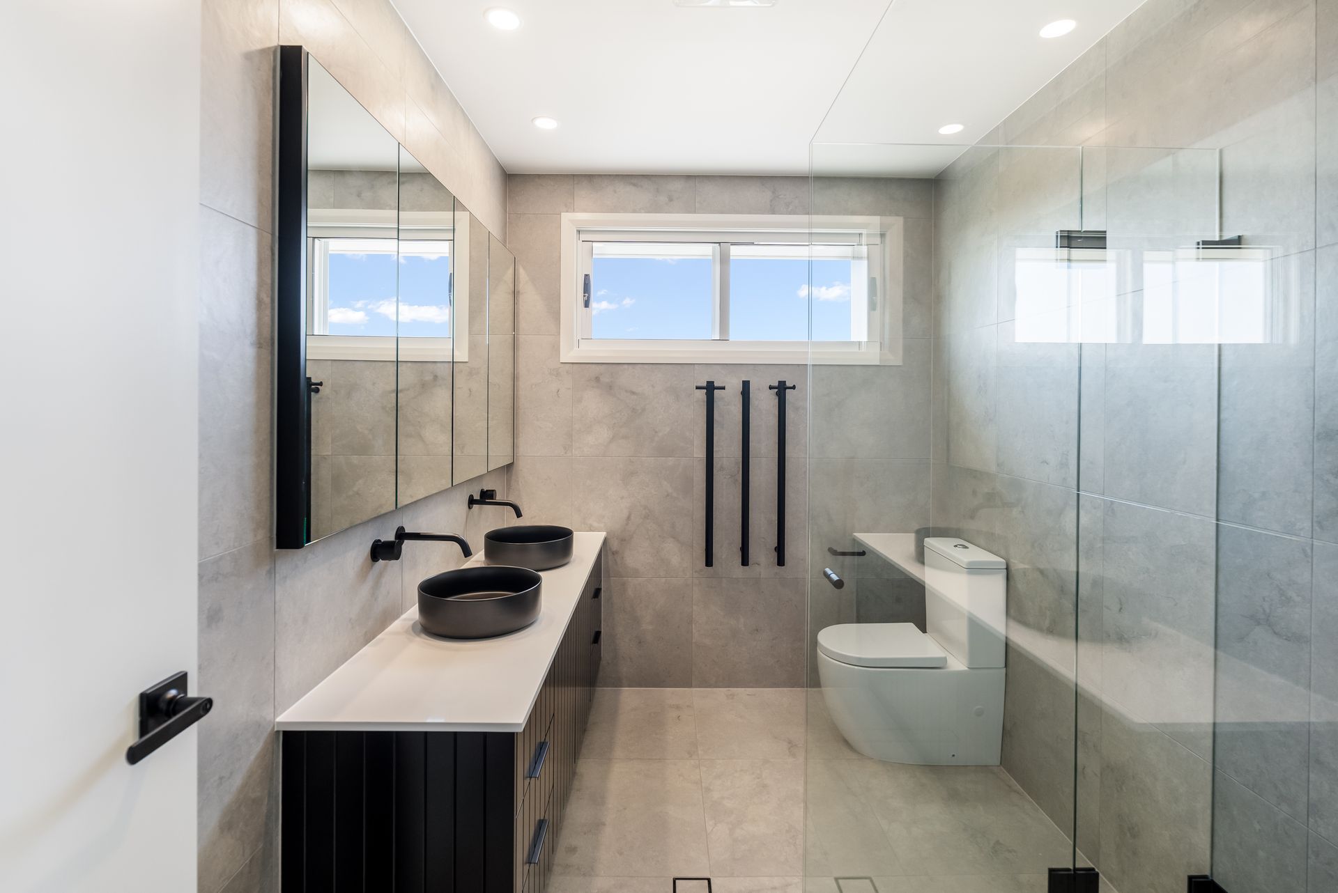 Modern Bathroom With Double Sink Vanity and Toilet in a Bright, Neutral Interior — Matt Made Building in Camden, NSW