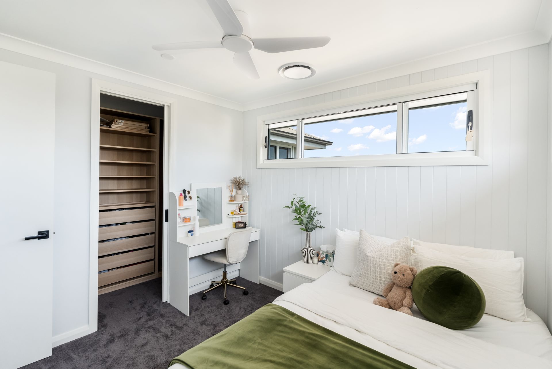 Bright Bedroom With White Walls, a Bed With Green Bedding and Window Light — Matt Made Building in Camden, NSW