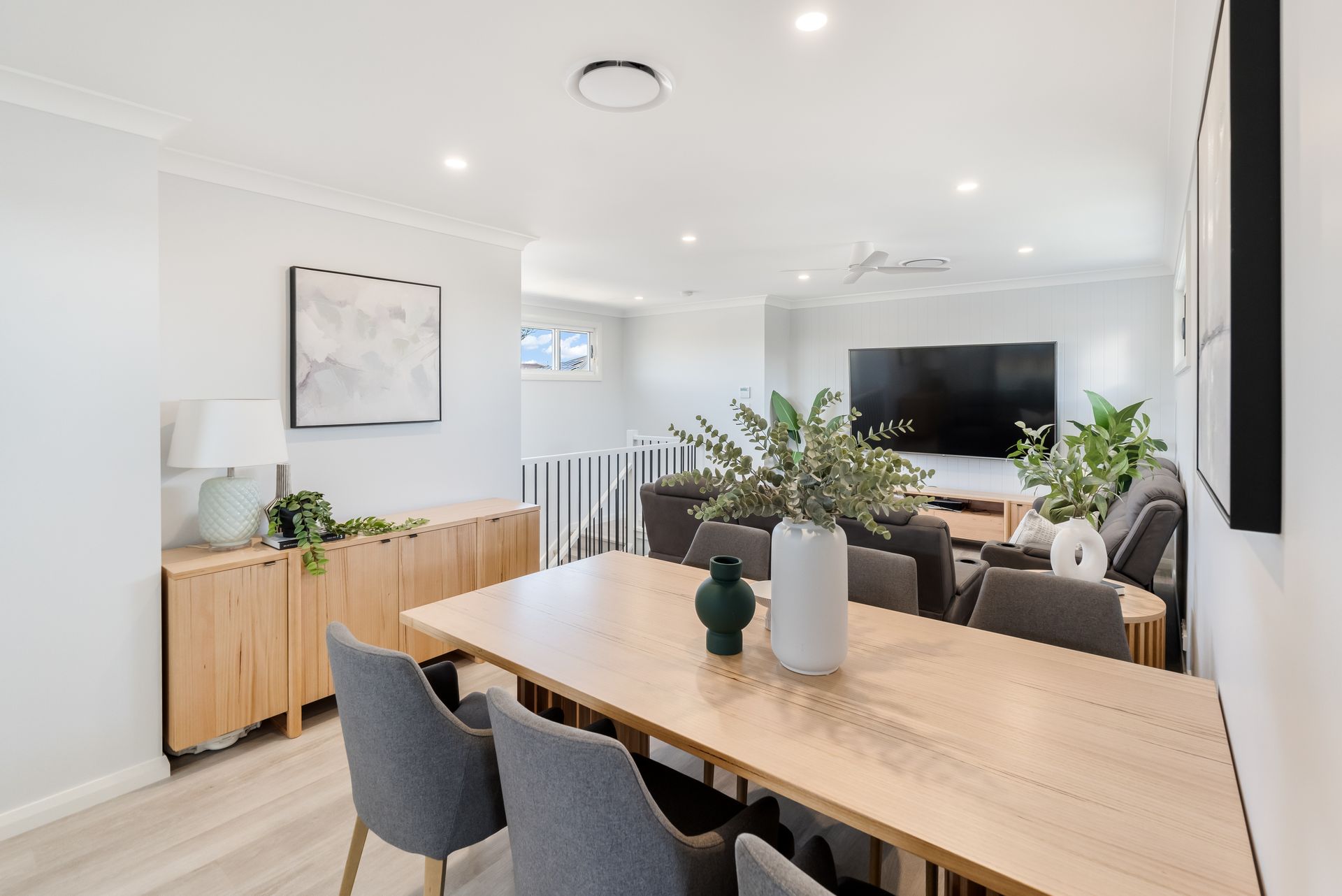 Bright Open Dining and Living Room With Wood Table and Indoor Plants — Matt Made Building in Camden, NSW