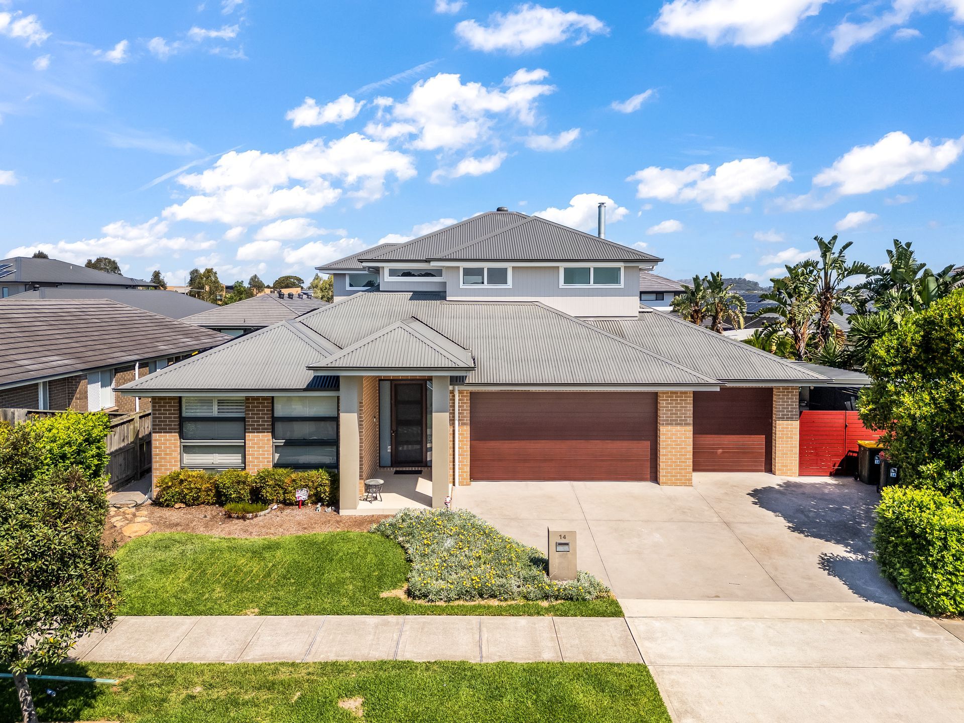 Suburban Two-story House With Gray Roof, Brick Facade — Matt Made Building in Camden, NSW