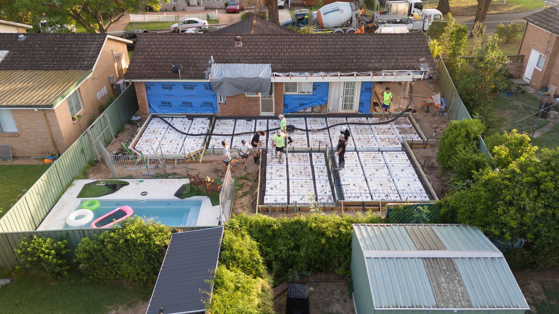 Aerial View of a House With Solar Panels on the Roof and a Fenced Backyard — Matt Made Building in Camden, NSW