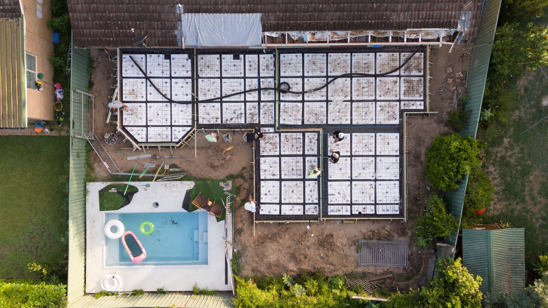 Aerial View of a House Roof Under Construction Beside a Backyard Pool and Garden — Matt Made Building in Camden, NSW