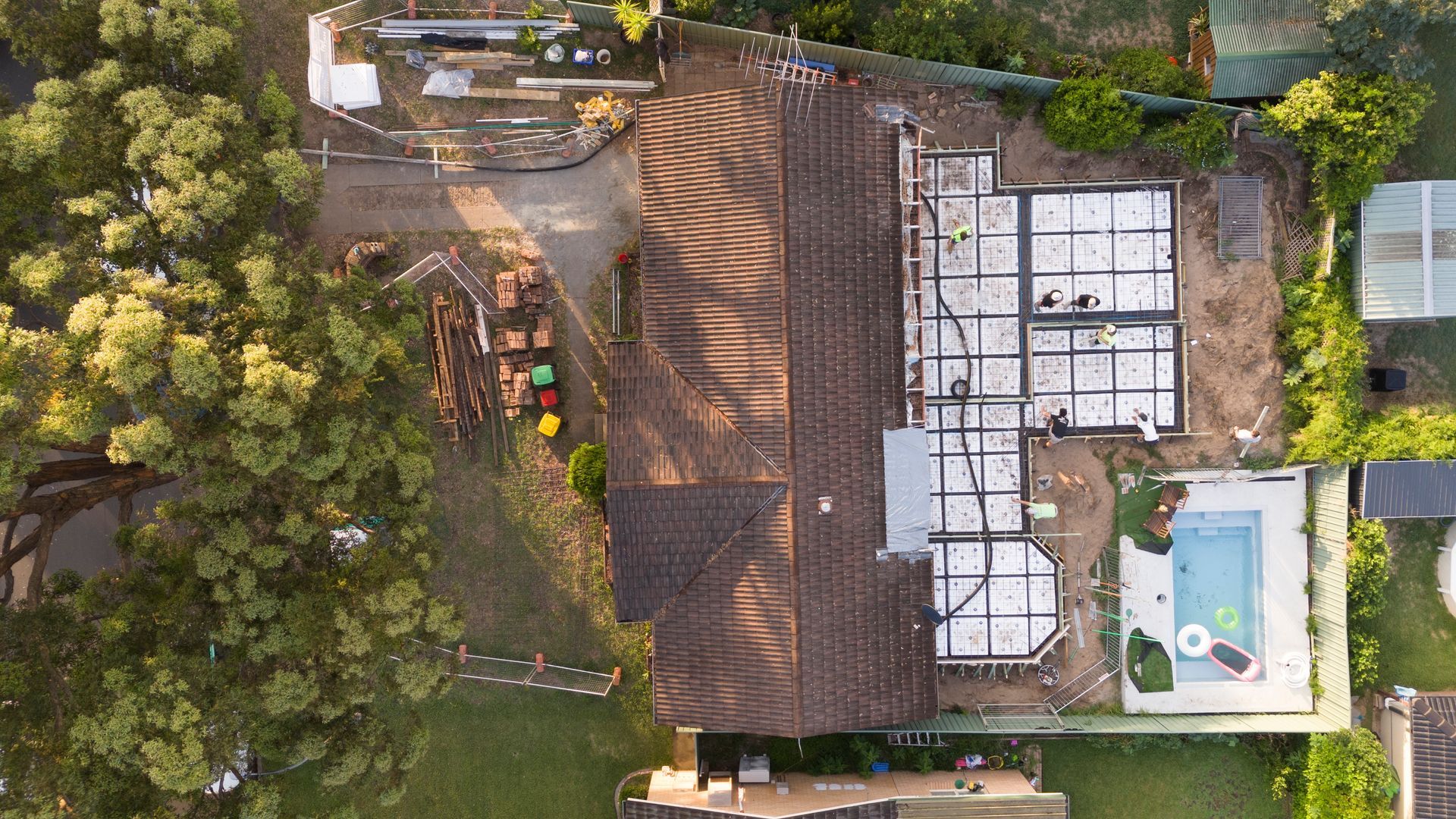 Aerial View of a House Roof With Trees and a Backyard Pool on the Right Side — Matt Made Building in Camden, NSW