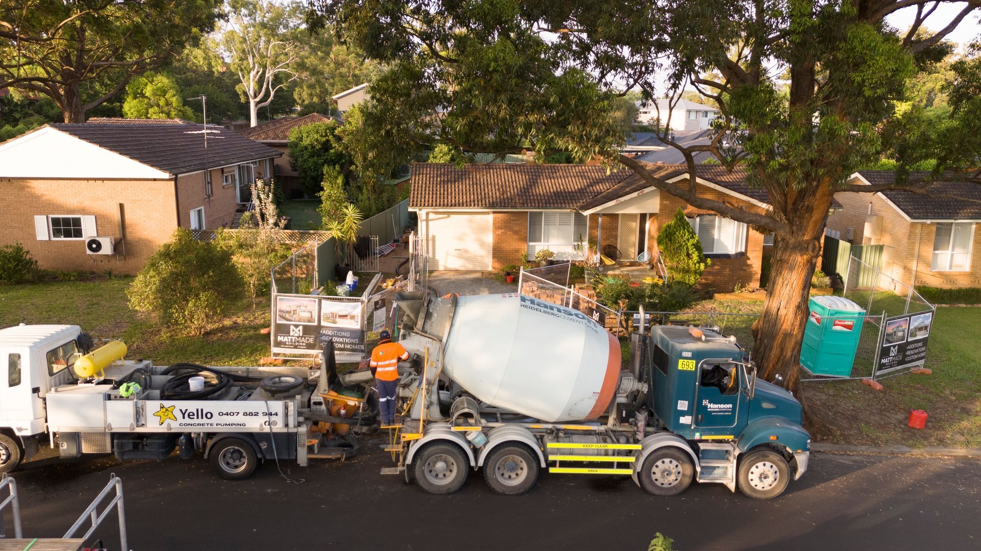 Construction Truck With Cement Mixer Parked on a Residential Street — Matt Made Building in Camden, NSW