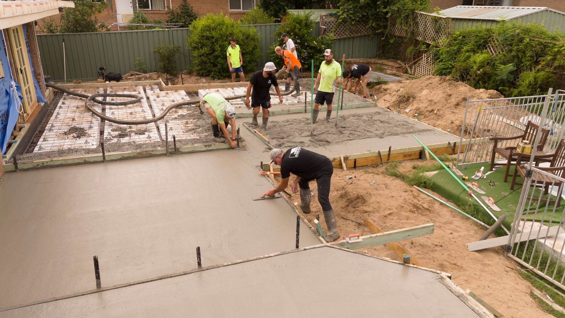 Workers Pouring a Concrete Driveway at a House Under Construction — Matt Made Building in Camden, NSW
