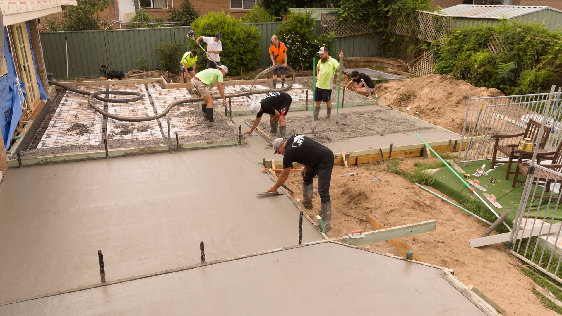 Workers Pouring and Smoothing Concrete for a House Foundation — Matt Made Building in Camden, NSW