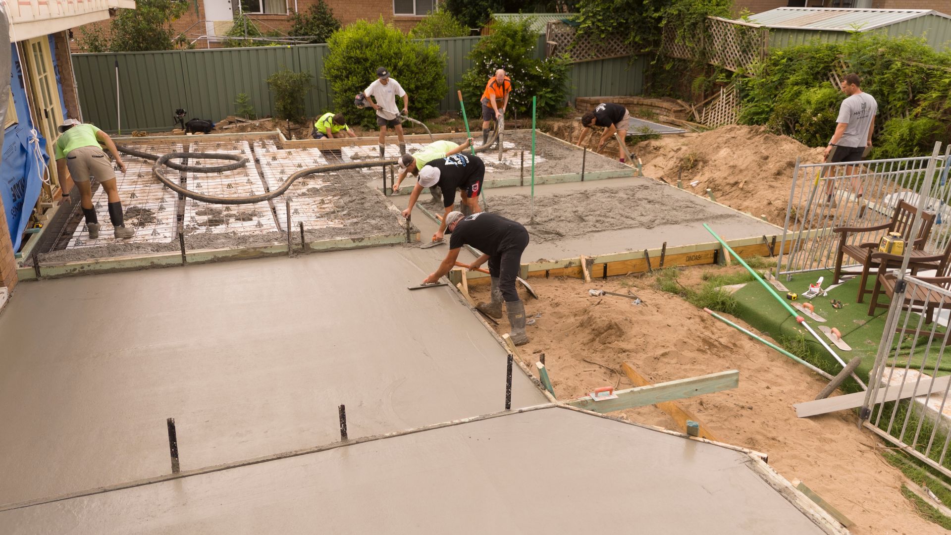 Workers Pouring Concrete for a Backyard Patio and Foundation Slab — Matt Made Building in Camden, NSW