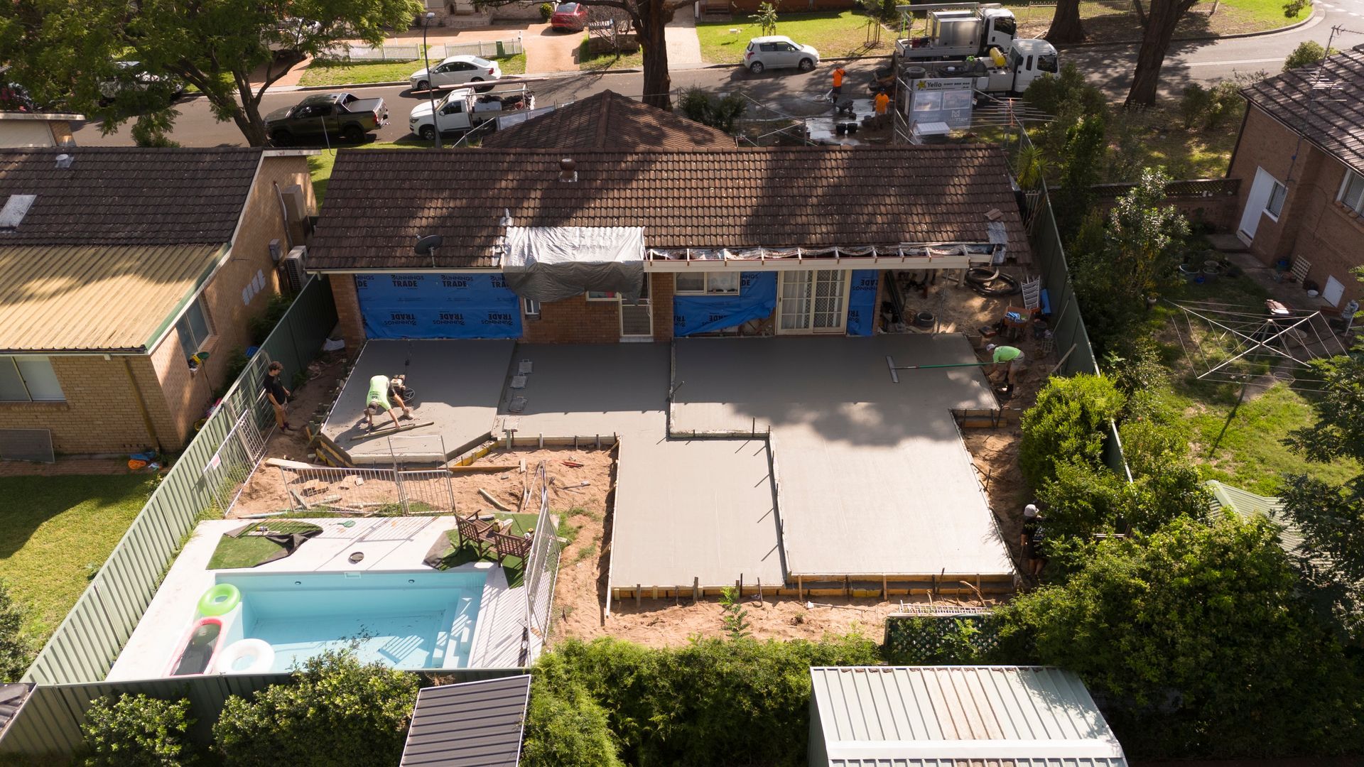 Aerial View of a Backyard With a Patio, Pool, and a Blue-front House Behind a Fence — Matt Made Building in Camden, NSW