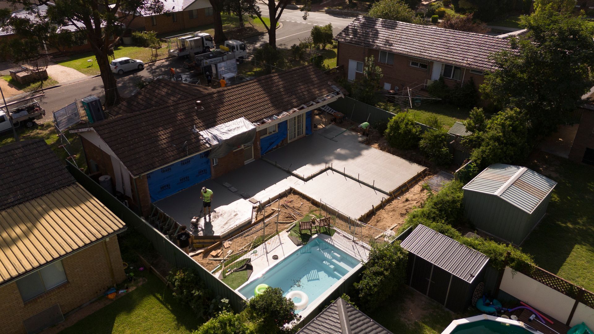 Aerial View of a Backyard With a Swimming Pool, Patio, and Several Small Buildings  — Matt Made Building in Camden, NSW