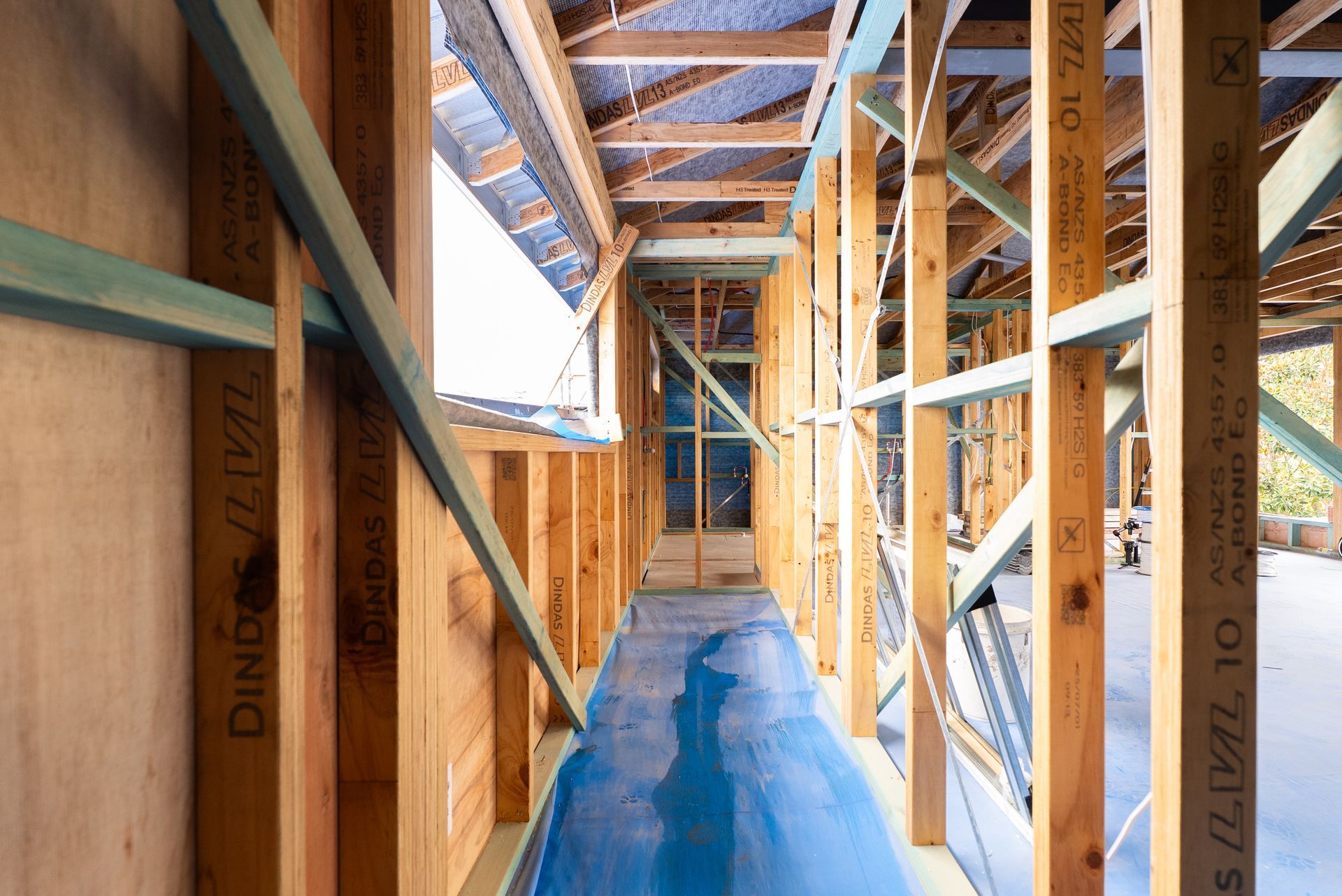 Framed House Hallway Under Construction With Exposed Wood Studs — Matt Made Building in Camden, NSW