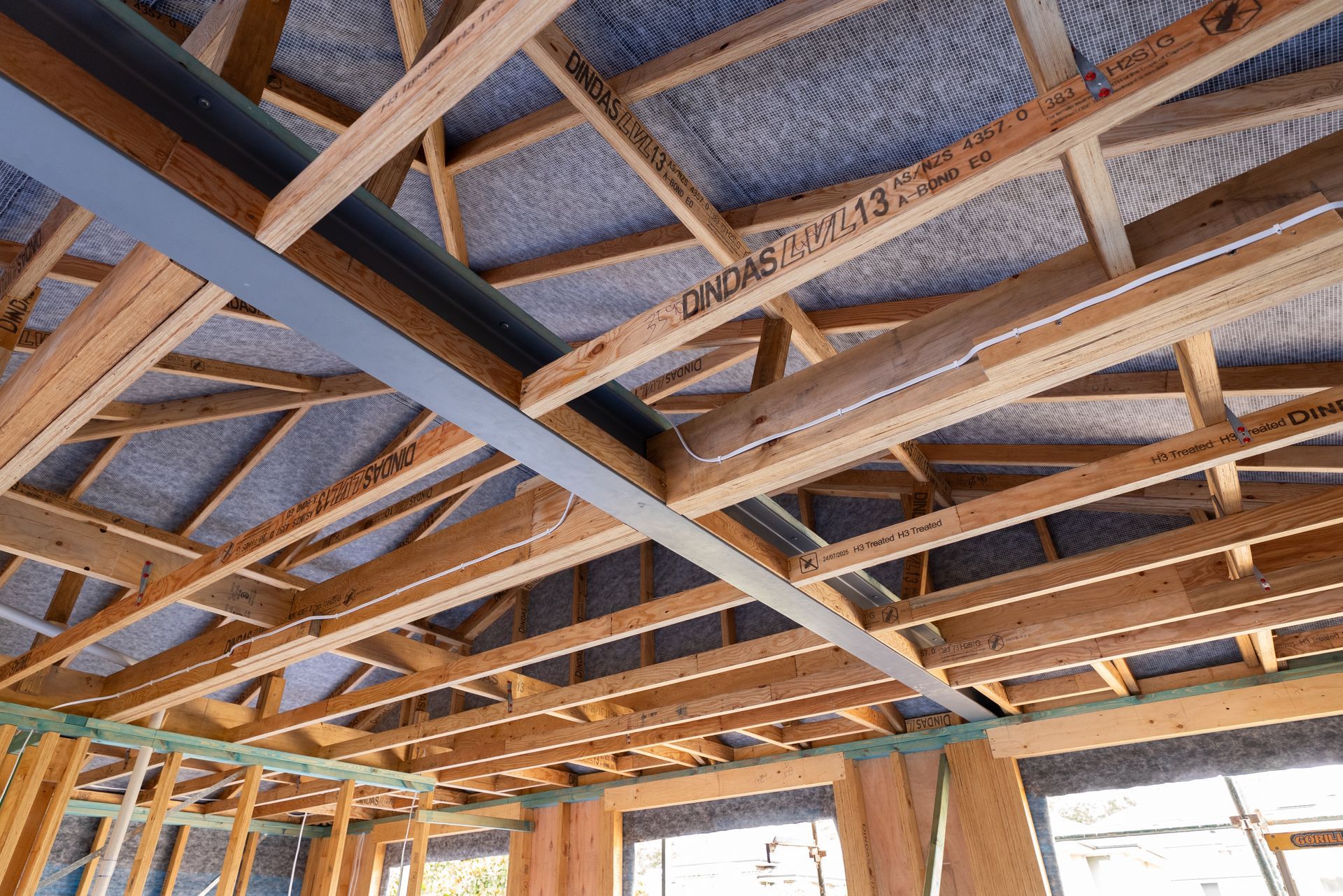 Wooden Roof Trusses and Plywood Sheathing Inside a House Under Construction — Matt Made Building in Camden, NSW