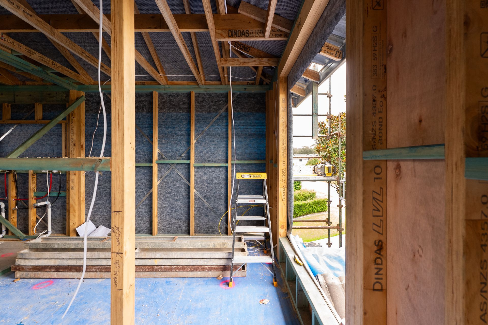 Interior of a House Under Construction With Exposed Framing and a Blue Floor Covering — Matt Made Building in Camden, NSW